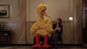 Allison Janney and Big Bird share a bench in The West Wing