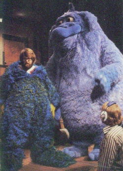 Dave Goelz peeping out of Timmy Monster, while Thog looks on