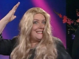 A member of the Electric Phoenix imitates Miss Piggy.