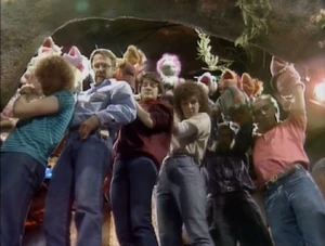 Muppeteers at Fraggle Rock watching their performance on a monitor (not seen.)