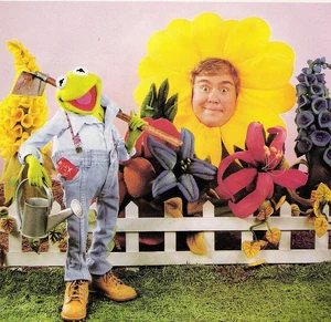 John Candy and Kermit in the garden.