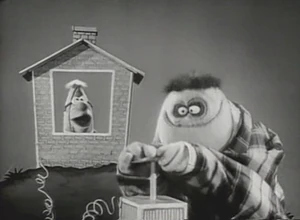 Tommy showing Fred that "A house is not a home without Kern's Bread!"