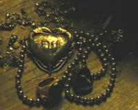 Tia's crab/heart shaped locket.