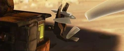 EVE holds WALL•E's hand.