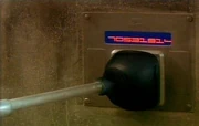 A Dalek uses a data pad.