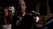 Lex pulls a gun on Kal.