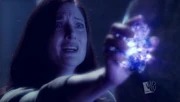 Martha holds the black kryptonite to Clark