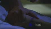 Clark holding Lois' hand.