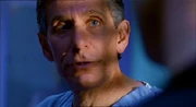 Dr. MacIntyre advises Lex on Lionel's eye surgery.