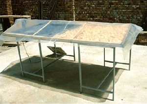 A tunnel solar food drier in use in Afghanistan
