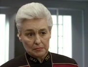 Andrea Brand wearing rear admiral insignia.