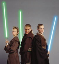 Jedi Master Cin Drallig (center) instructs Whie (left) and Bene (right) in lightsaber use.