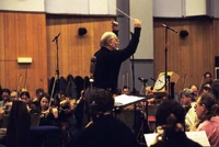 Williams directing the London Symphony Orchestra.