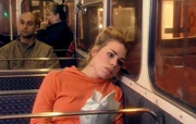 Rose as a teenager on a bus at night, eating chips. (DW: Army of Ghosts)