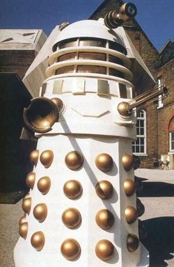 A later Imperial Dalek in the courtyard of Coal Hill School, with an Imperial Dalek Shuttle in the background (DW: Remembrance of the Daleks)