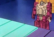 Scorponok watches as G-Metal is forged.