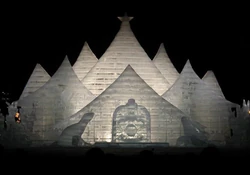 An internally illuminated ice building at the Sapporo Snow Festival.  Sapporo, Japan.