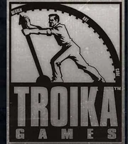The Troika Games logo. Designed by somebody who likes gears and people working them.