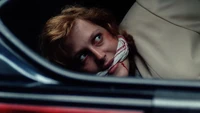 Scully in the trunk of Duane Barry's car