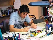 Kazuki Takahashi working in his studio.